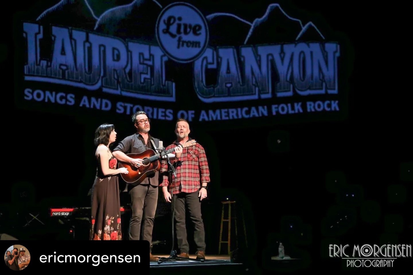 On stage, under the canyon banner